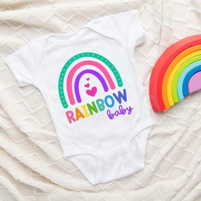 Celebrate pregnancy and childbirth after a loss with this beautiful Rainbow Baby SVG. Perfect for making DIY onesies with your Cricut or SIlhouette. Includes links to 16 free rainbow cut files. #rainbowbaby #miscarriage #infantloss #cricut #Silhouette #CricutMade #CricutCreated #DIY #CuttingMachineCrafting #onesie #DIYOnesie