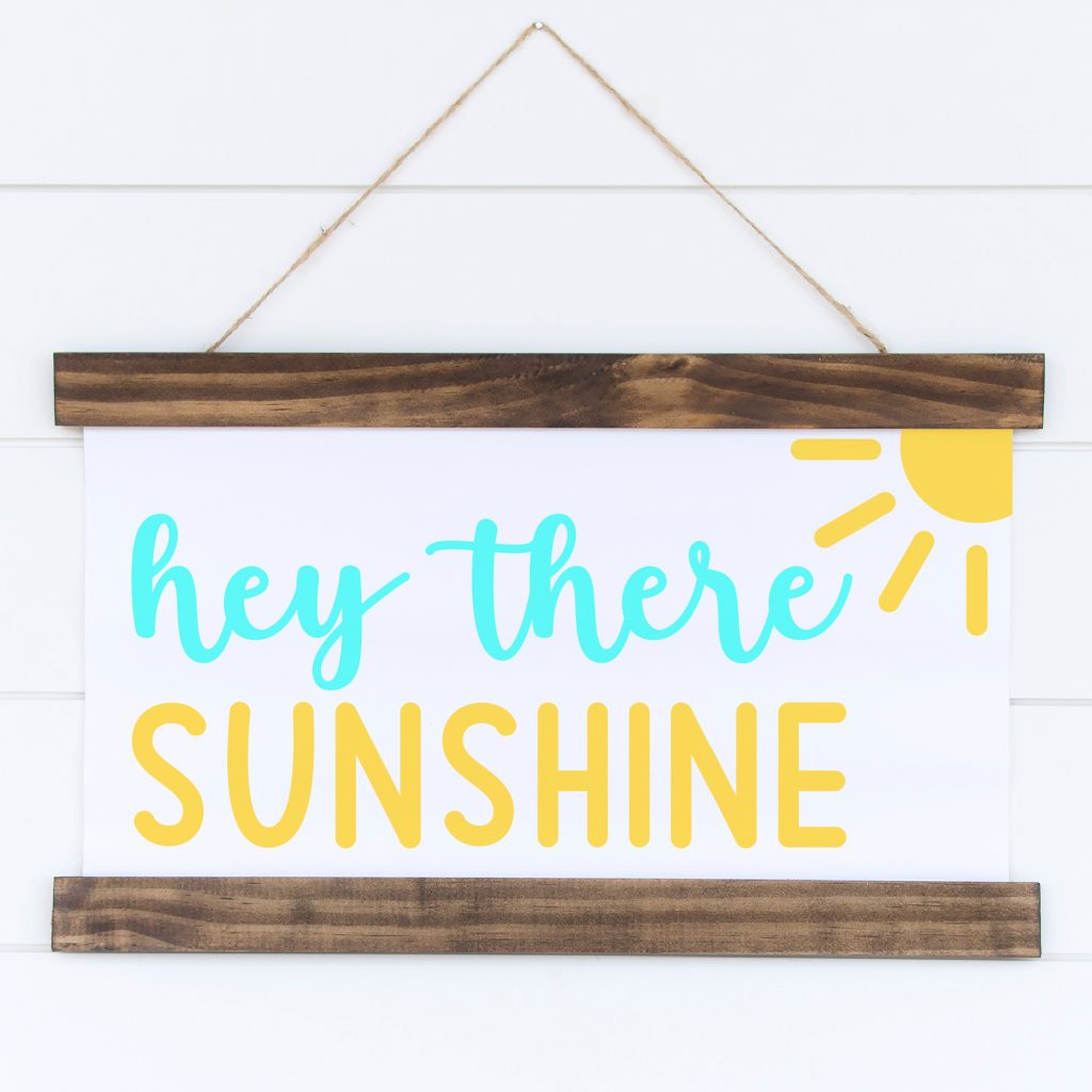 Spread a bit of crafty happiness with this free Hey There Sunshine Cut File! So cute for DIY signs and beach totes! Download all 11 free welcome sign svgs for crafting with your Cricut Maker, Cricut Explore Air 2, Cricut Joy or other cutting machine! Make great handmade housewarming gifts! 