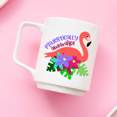 Make flamingo stickers, shirts, beach bags mugs and more with 14 free flamingo cut files! The majestically awkward SVG is so cute! Perfect for summer crafting with your Cricut, Silhouette or other electronic cutting machine! So fun for DIY party favors for tropical themed parties!